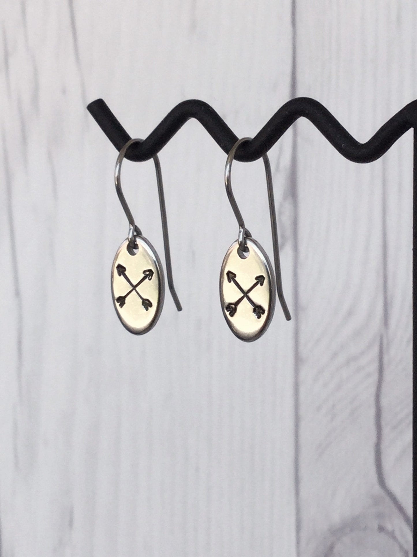Crossed Arrows Oval Stainless Steel Earrings
